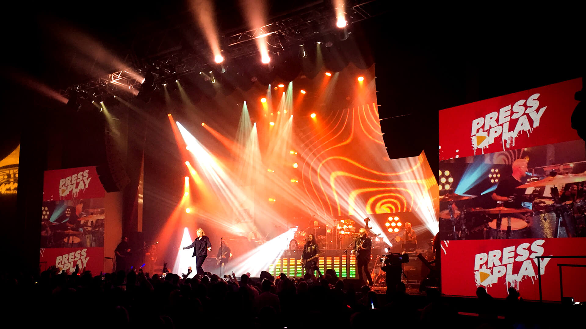 Live concert production setup with dramatic stage lighting and visual effects at a music festival