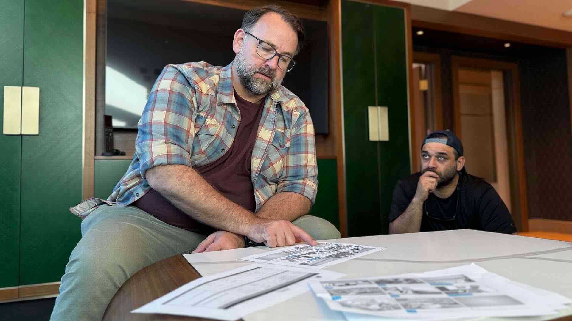 Pre-Production Services Pre-production planning session with team reviewing scripts and logistics for a video shoot