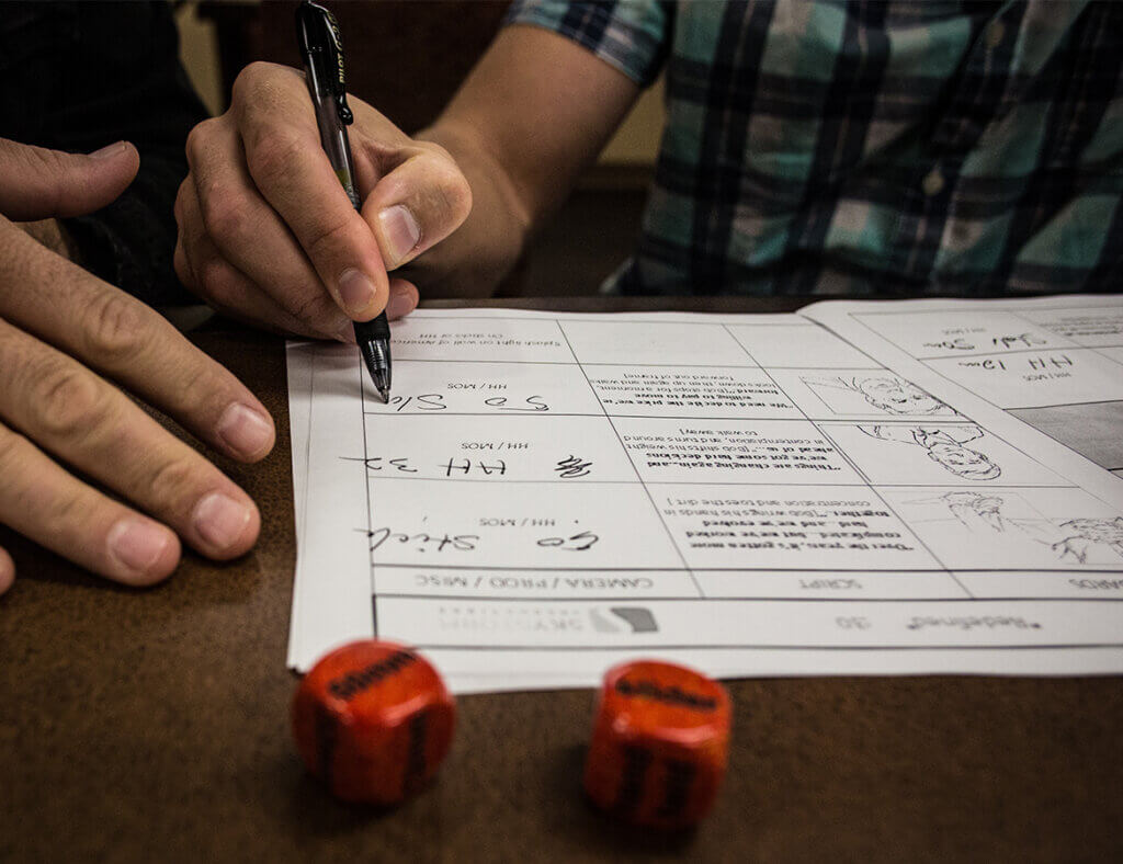 Creative - Crafting Your Story Together Scriptwriter reviewing film script draft for client approval