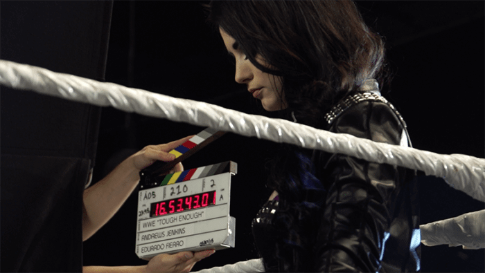 slate-labels-700x395 Slating a shot for WWE 'Tough Enough' with clapperboard near female talent in a boxing ring